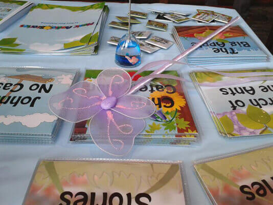 Music Audio Stories table layout of our merchandise at the Family Fundraiser image